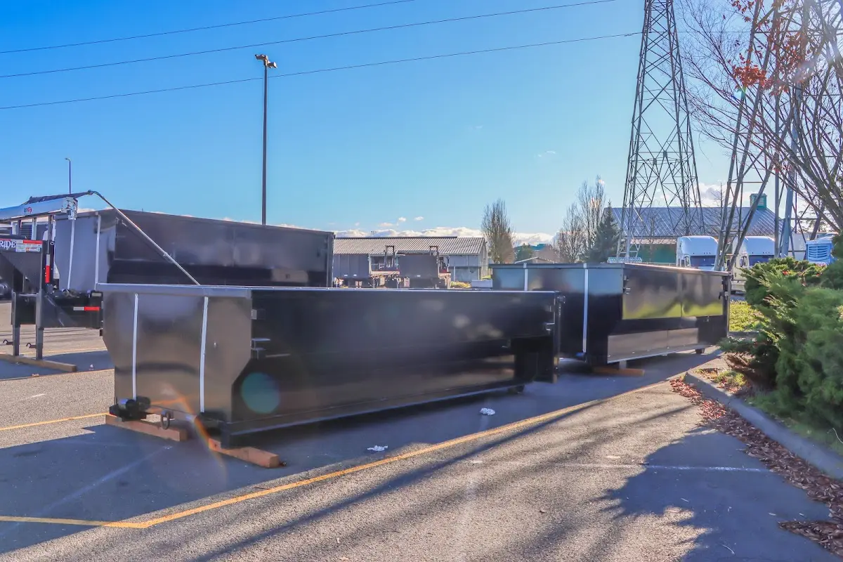 Roll-off dumpster ready for waste disposal at job site for Construction Dumpster Rental in Burke